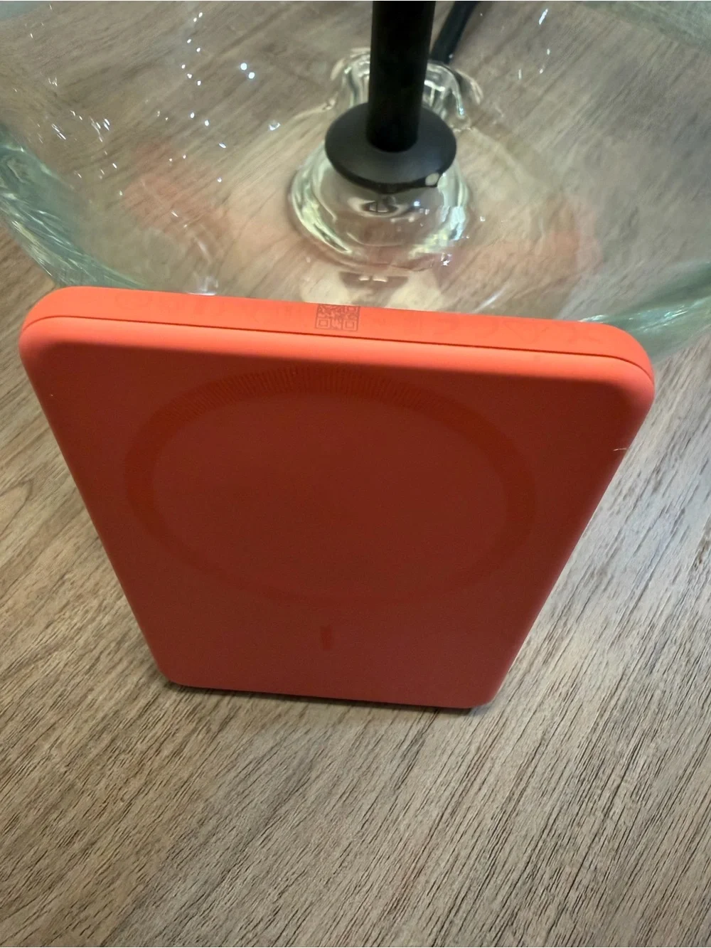 Anker Coral Orange Power Bank, Satechi Magnetic Wallet Stand, and Pop Socket